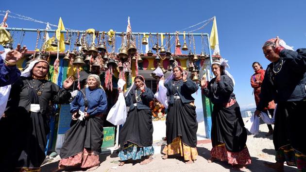 Village women break into song and dance singing traditional folk songs before an occasional feast for devotees and tourists. (Gurinder Osan/HT PHOTO)