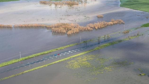 An image showing three vehicles stranded on a highway flooded after Cyclone Debbie passed through the region near the township of Gunyarra, located south of the town of Bowen in Queensland, Australia. (Australia Defence Force/Handout via REUTERS ) An image showing three vehicles stranded on a highway flooded after Cyclone Debbie passed through the region near the township of Gunyarra, located south of the town of Bowen in Queensland, Australia. (Australia Defence Force/Handout via REUTERS )