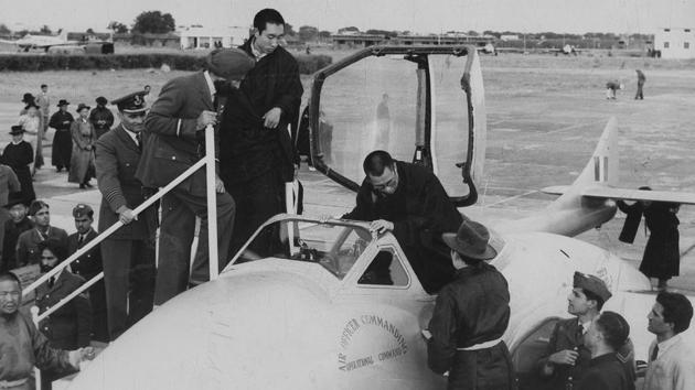 The Dalai Lama and Choekyi Gyaltsen, Panchen Lama being shown a Vampire Jet Fighter during a IAF station tour in New Delhi. (Ht Photo)