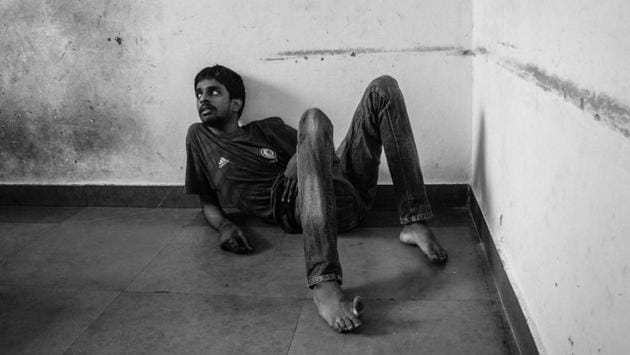 Gokul sits on the floor in a strange posture as he looks away from the camera. Autistic individuals have trouble with things that come naturally to us like pointing at things and maintaining eye contact with people, and cameras too. (Vageesh Lall/ HT Photo)