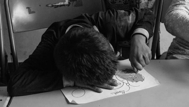 Piyush colors in a butterfly during a session of coloring as part of his routine. Coloring exercise helps children develop fine motor skills. (Vageesh Lall/ HT Photo)