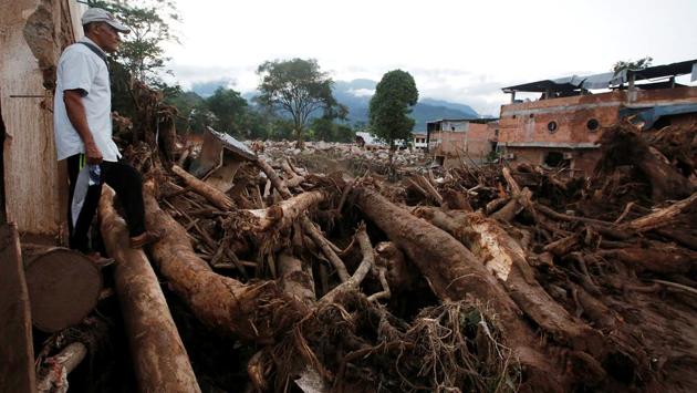 A man looks at a destroyed area after heavy rains caused several rivers to overflow, pushing sediment and rocks into buildings and roads in Mocoa. The mudslides slammed Mocoa late Friday after days of torrential rain in the Amazon basin area town of 40,000. (Jaime Saldarriaga/REUTERS)