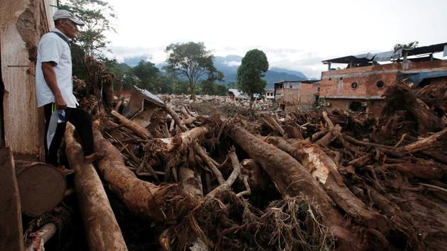 A man looks at a destroyed area after heavy rains caused several rivers to overflow, pushing sediment and rocks into buildings and roads in Mocoa, Colombia on April 1, 2017. (Jaime Saldarriaga/REUTERS)