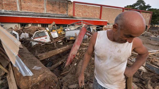A man looks at the damage caused by mudslides following heavy rains in Mocoa, Putumayo department, southern Colombia. One thousand emergency personnel, including soldiers and local police, were helping the rescue effort. (Luis Robayo/AFP)
