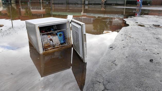 A fridge full of food sits in a flooded street in the northern New South Wales town of Lismore, Australia on April 1, 2017 after heavy rains associated with Cyclone Debbie swelled rivers to record heights across the region. (AAP/Tracey Nearmy/REUTERS)
