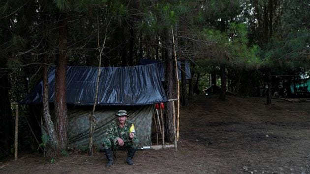 Juancho smokes a cigarette outside his makeshift tent in Los Robles, Colombia. (Federico Rios/REUTERS) Juancho smokes a cigarette outside his makeshift tent in Los Robles, Colombia. (Federico Rios/REUTERS)