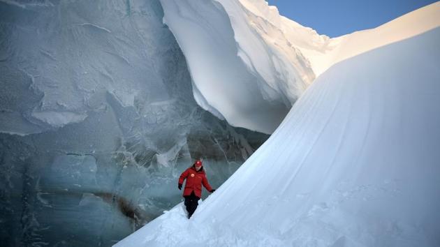 Russian President Vladimir Putin visits an ice cavern on Alexandra Land Island in the remote Arctic islands of Franz Josef Land on March 29, 2017. (Alexey Druzhinin/AFP)