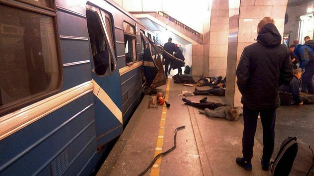 Blast victims lie near a subway train hit by an explosion at the Tekhnologichesky Institut subway station in St.Petersburg. There were reports that the device used in the blasts was filled with shrapnel. (AP/PTI) Blast victims lie near a subway train hit by an explosion at the Tekhnologichesky Institut subway station in St.Petersburg. There were reports that the device used in the blasts was filled with shrapnel. (AP/PTI)