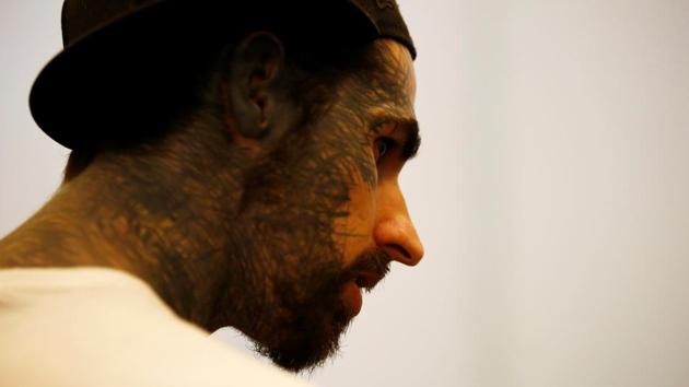 A man with tattoo on his face attends the Nepal Tattoo Convention. (Navesh Chitrakar / Reuters)