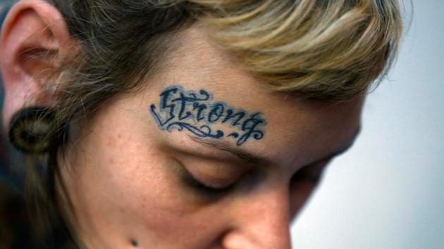 A tattoo artist with a tattoo on her forehead that reads ‘Strong’ is pictured during the Nepal Tattoo Convention. (Navesh Chitrakar / Reuters)