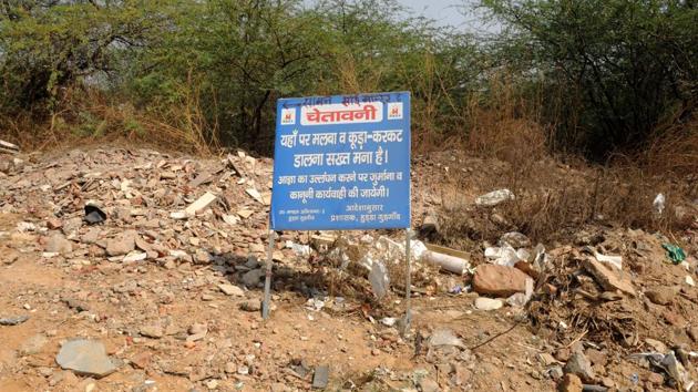 Construction waste dumped on Gurgaon-Faridabad Road in the Aravalli Hills region. (HT FILE PHOTO) Construction waste dumped on Gurgaon-Faridabad Road in the Aravalli Hills region. (HT FILE PHOTO)