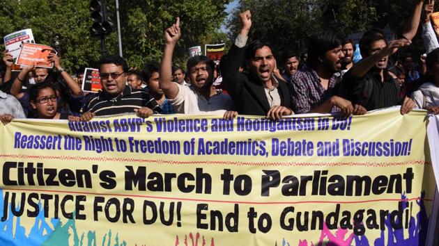 Students from Delhi University and Jawaharlal Nehru University shout slogans as they march behind a banner during a rally in New Delhi on March 4, 2017(AFP)