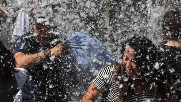 Hundreds of people have gathered in University Square in central Bucharest to mark International Pillow Day. (Mark RALSTON / AFP)