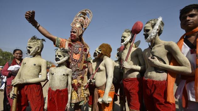 Artists dressed as lord Hanuman takes a selfie during a procession celebrating Ram Navami in New Delhi. (Raj K Raj/HT PHOTO)
