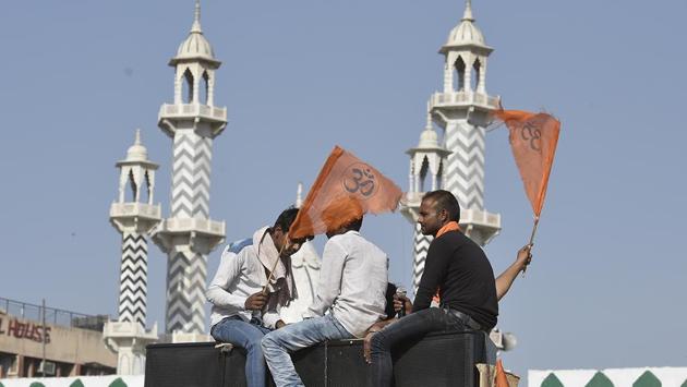 Hindu youth sit atop a truck before the start of the procession from Delhi’s Ramlila Maidan to Karol Bagh. (Raj K Raj/HT PHOTO)