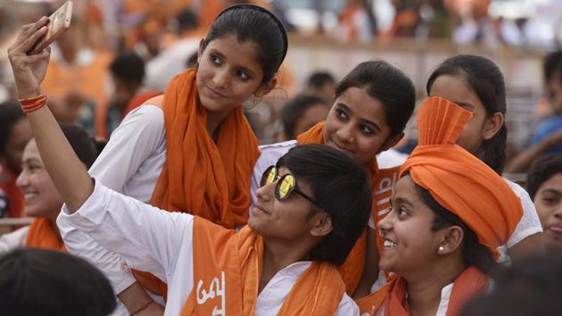 Members of VHP’s women’s wing Durga Vahini taking a group selfie before the procession. Approximately 5000 people participated in this march. (Raj K Raj/HT PHOTO)