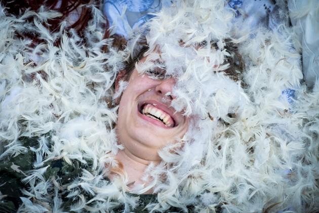 Feathers fly at a pillow fight in central Bucharest, Romania. (ANDREI PUNGOVSCHI / AFP)