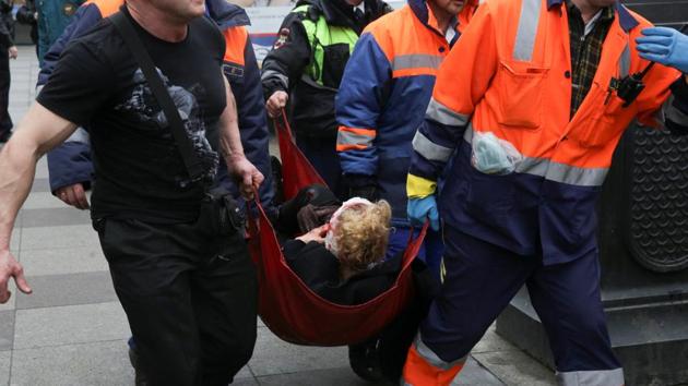 An injured person is helped by emergency services outside Sennaya Ploshchad metro station. Kremlin spokesman Dmitry Peskov said President Vladimir Putin was informed about the blast. (Anton Vaganov/REUTERS) An injured person is helped by emergency services outside Sennaya Ploshchad metro station. Kremlin spokesman Dmitry Peskov said President Vladimir Putin was informed about the blast. (Anton Vaganov/REUTERS)