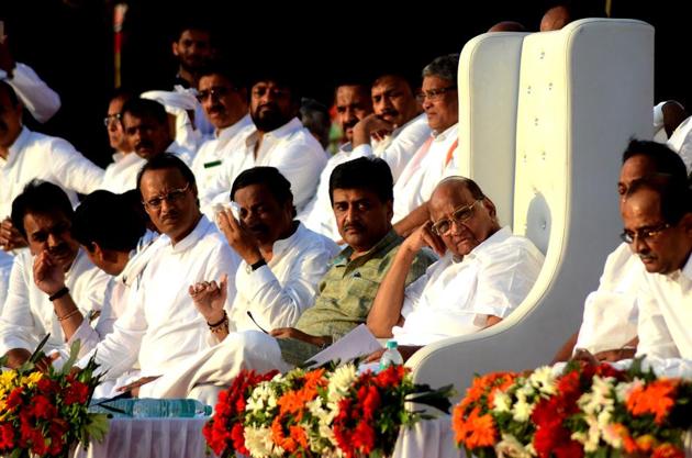 NCP chief Sharad Pawar (extreme right) with Congress leader Ashok Chavan (second from right) and NCP leaders Sunil Tatkare and Ajit Pawar (extreme left) at a rally in Panvel. NCP chief Sharad Pawar (extreme right) with Congress leader Ashok Chavan (second from right) and NCP leaders Sunil Tatkare and Ajit Pawar (extreme left) at a rally in Panvel.