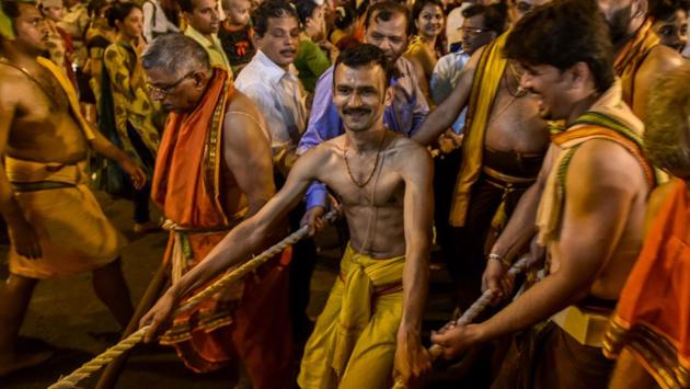 Priests take part in the procession. (Kunal Patil/HT Photo) 
