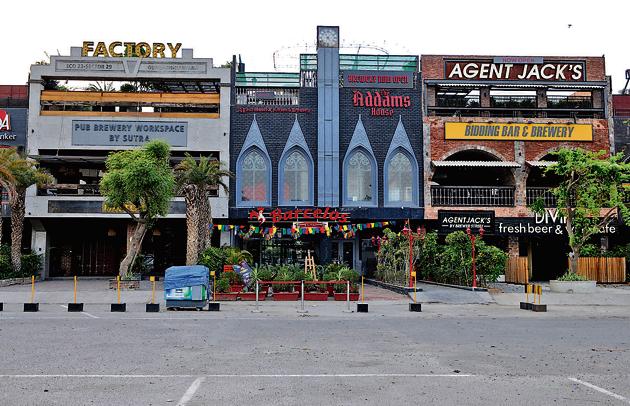 According to owners and managers bars and pubs, hardly anybody visits just to eat and their businesses survived largely on liquor. They also reported a drop in sales due to lower footfall.(Parveen Kumar/HT Photo)