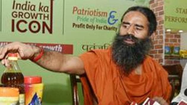 Yoga guru Ramdev displaying Patanjali products in New Delhi.(HT File Photo) Yoga guru Ramdev displaying Patanjali products in New Delhi.(HT File Photo)