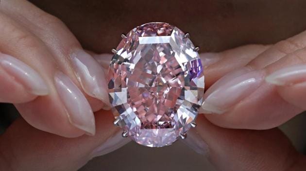 File photo of the "Pink Star", the most valuable cut diamond ever offered at auction, while on display at a Sotheby's auction room in Hong Kong on March 29, 2017. The 59.6-carat diamond was sold for $71.2 million at an auction, setting a record for any diamond or jewel. It's also the highest price for any work ever sold at auction in Asia. (AP) File photo of the "Pink Star", the most valuable cut diamond ever offered at auction, while on display at a Sotheby's auction room in Hong Kong on March 29, 2017. The 59.6-carat diamond was sold for $71.2 million at an auction, setting a record for any diamond or jewel. It's also the highest price for any work ever sold at auction in Asia. (AP)