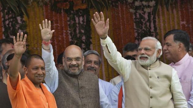 From right, Prime Minister Narendra Modi, Bharatiya Janata Party president Amit Shah and UP chief minister Yogi Adityanath, in Lucknow, March 19. It is shocking to read some people who were regular and prominent faces at ‘Liberal’ feasts today seeking a chance for Yogi Adityanath on the development plank.(AP) From right, Prime Minister Narendra Modi, Bharatiya Janata Party president Amit Shah and UP chief minister Yogi Adityanath, in Lucknow, March 19. It is shocking to read some people who were regular and prominent faces at ‘Liberal’ feasts today seeking a chance for Yogi Adityanath on the development plank.(AP)
