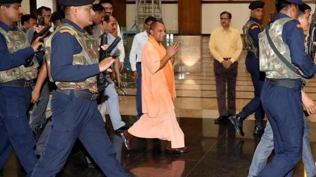 Uttar Pradesh chief minister Yogi Adityanath arrives to attend his first cabinet meeting at Lok Bhavan in Lucknow on Tuesday.(REUTERS) Uttar Pradesh chief minister Yogi Adityanath arrives to attend his first cabinet meeting at Lok Bhavan in Lucknow on Tuesday.(REUTERS)