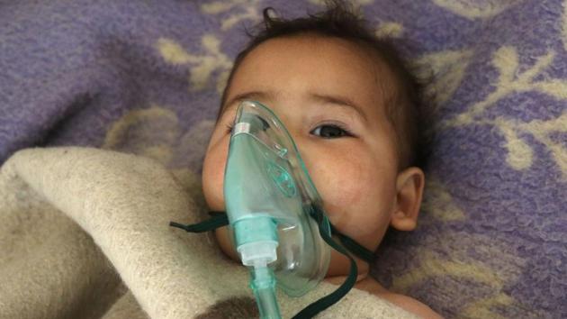 A Syrian child receives treatment at a small hospital in the town of Maaret al-Noman following a suspected toxic gas attack in Khan Sheikhun, a nearby rebel-held town in Syria’s northwestern Idlib province, on April 4, 2017. Warplanes carried out a suspected toxic gas attack that killed at least 35 people including several children, a monitoring group said. The Syrian Observatory for Human Rights said those killed in the town of Khan Sheikhun, in Idlib province, had died from the effects of the gas, adding that dozens more suffered respiratory problems and other symptoms. / (Mohamed al-Bakour / AFP)