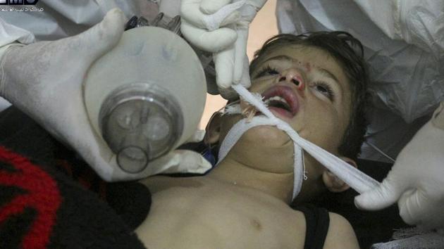 This photo provided by the Syrian anti-government activist group Edlib Media Center, which has been authenticated based on its contents and other AP reporting, shows Syrian doctors treating a child following a suspected chemical attack, at a makeshift hospital, in the town of Khan Sheikhoun, northern Idlib province, Syria. (AP Photo) This photo provided by the Syrian anti-government activist group Edlib Media Center, which has been authenticated based on its contents and other AP reporting, shows Syrian doctors treating a child following a suspected chemical attack, at a makeshift hospital, in the town of Khan Sheikhoun, northern Idlib province, Syria. (AP Photo)
