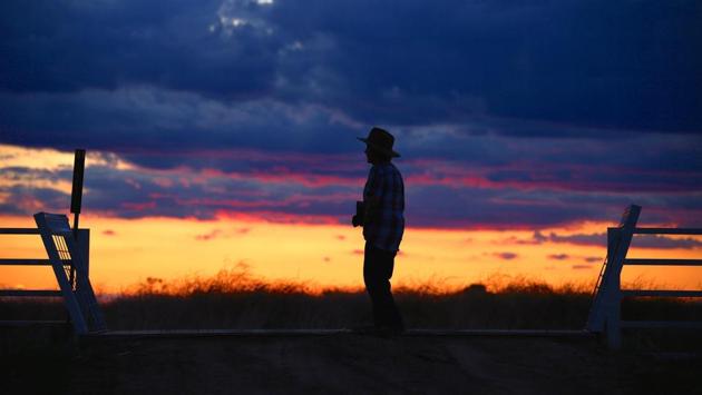 May McKeown stands at the main gates at sunset. “Oh, you get all sorts of comments,” McKeown said. “But I know sons of farmers nowadays who can’t drive a tractor, let alone ride a horse like me, and I’m nearly 80!” (David Gray/REUTERS) May McKeown stands at the main gates at sunset. “Oh, you get all sorts of comments,” McKeown said. “But I know sons of farmers nowadays who can’t drive a tractor, let alone ride a horse like me, and I’m nearly 80!” (David Gray/REUTERS)