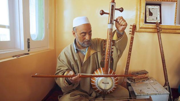 Sheikh began teaching young Kashmiris in a bid to preserve the Sufi musical tradition of the picturesque Himalayan region, which has been divided between India and Pakistan since partition but is claimed by both countries. (PARVAIZ BUKHARI / AFP)