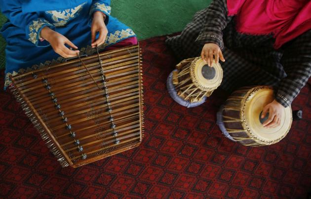 Kashmiri Muslim girls play Sufi music under the tutelage of music teacher, Muhammad Yaqoob Sheikh, on the outskirts of Srinagar. (PARVAIZ BUKHARI / AFP)