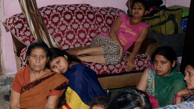 Family members of deceased police cop Suresh Kumar at Indira colony in Ludhiana on Wednesday.