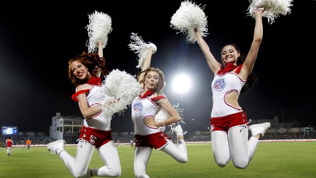 Cheerleaders for Kings XI Punjab perform during the IPL season of 2013. No one goes regularly to the Staples Centre in Los Angeles for the cheerleaders, or takes the train from central London to Wimbledon because Cliff Richard might sing a few oldies if it’s raining.These may be welcome bonuses, but the reason one makes these trips is a chance to witness the pinnacle of sport.(Ajay Aggarwal/HT Photo)
