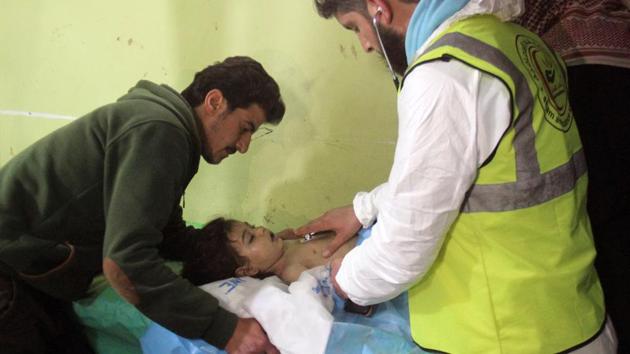 An unconscious Syrian child receives treatment at a hospital in Khan Sheikhun, a rebel-held town in the northwestern Syrian Idlib province, following a suspected toxic gas attack . (Omar haj kadour / AFP)