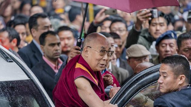The 81-year-old spiritual leader was scheduled to fly to Tawang, a Buddhist pilgrimage at 10,000 feet, along with chief minister Pema Khandu. But the state-run helicopter could not take off from the airport in Guwahati due to torrential rain. (Tenzin Choejor / AP)