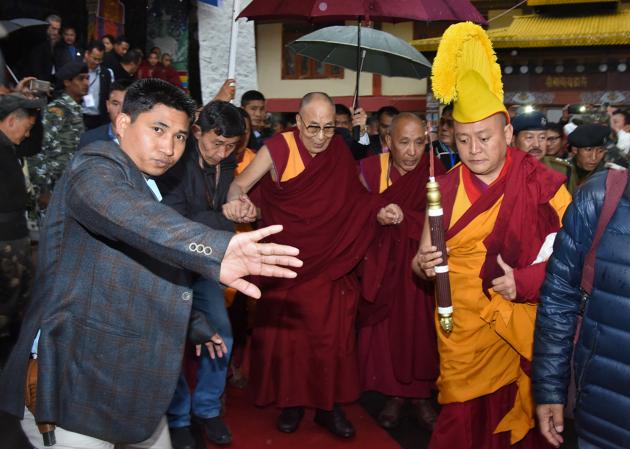 Tibetan spiritual leader the Dalai Lama arrives at the Thubchog Gatsel Ling Monastery in Bomdila in Arunachal Pradesh. Almost everyone who matters in Arunachal Pradesh – from ministers and local MLAs to the chief secretary and director general of police – had queued up in the rain to greet him. (Anuwar Hazarika / REUTERS)