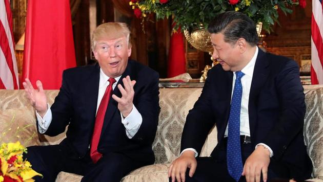 US President Donald Trump interacts with Chinese President Xi Jinping at Mar-a-Lago state in Palm Beach, Florida on Thursday.(REUTERS)