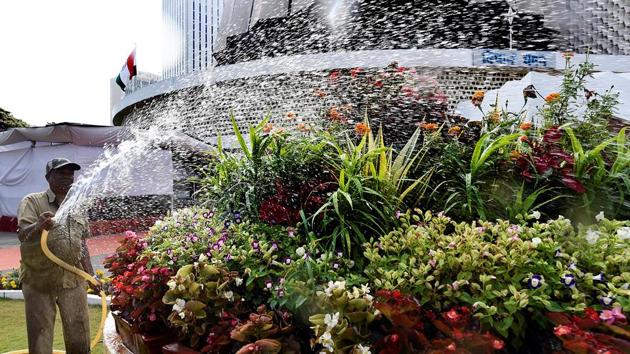 NURTURE FOR NATURE: A gardener ensures the plants get the moisture they need. (Anshuman Poyrekar/HT Photo)