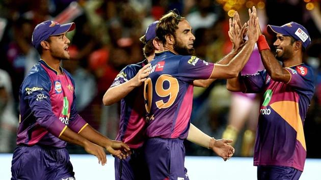 Rising Pune Supergiants bowler Imran Tahir celebrates the wicket of Mumbai Indians batsman Jos Buttler. (PTI)