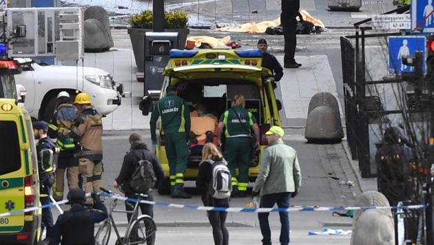 Ambulance in a street near the site were a truck was driven into a crowd in central Stockholm, killing at least three people. (REUTERS) Ambulance in a street near the site were a truck was driven into a crowd in central Stockholm, killing at least three people. (REUTERS)