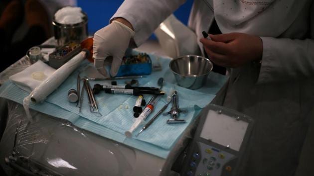 A Palestinian nurse prepares medical tools at Al Awda Hospital, a private medical facility in the northern Gaza Strip. Although it exempts from the ban Gazans seeking “life-saving or life-changing medical treatment” if it is unavailable in the territory, crossing the border isn’t easy. (Mohammed Salem/REUTERS)