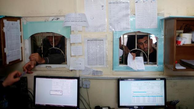 Palestinian patients present their documents as they wait to receive treatment at Shifa hospital. Gaza human rights groups say Israeli security at the crossing with the territory sometimes question patients in an attempt to gather intelligence or recruit them as informers. (Mohammed Salem/REUTERS)