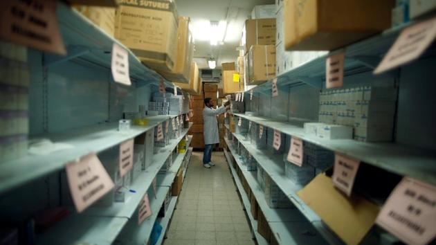 An employee checks medicines at a warehouse run by health ministry. Treatment for an estimated 6,000 cerebral palsy patients poses a particular problem. Many families cannot afford the cost of care and some do not want to expose their loved ones’ affliction to outsiders. (Mohammed Salem/REUTERS)