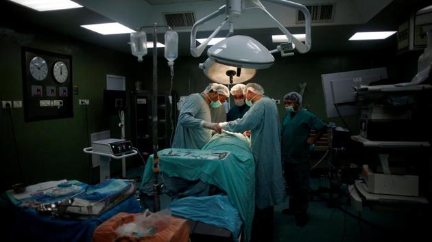 Doctors and medics perform a surgery for Palestinian woman Sadeya al-Shafi, 60, in the operating room at Shifa hospital. In figures posted on the website a month ago, COGAT said that between January 2015 and September 2016, some 200 medical personnel from the Gaza Strip participated in training courses at leading hospitals in Israel. (Mohammed Salem/REUTERS)