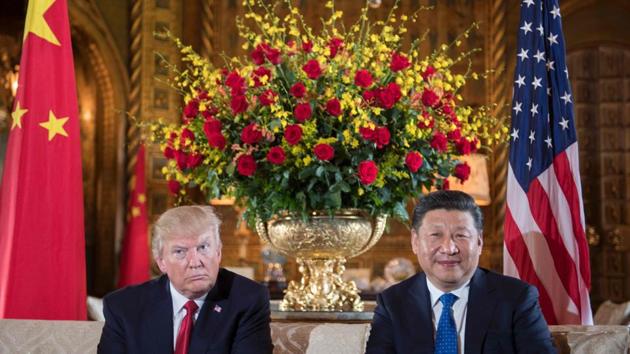 US President Donald Trump (L) sits with Chinese President Xi Jinping (R) during a bilateral meeting at the Mar-a-Lago estate in West Palm Beach, Florida. (Jim Watson/AFP)