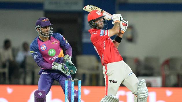 Kings XI Punjab batsman Glenn Maxwell pulls one as Rising Pune Supergiants wicketkeeper MS Dhoni looks on during their Indian Premier League match at the Holkar Stadium in Indore on Saturday. (AFP)