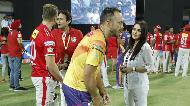 Ness Wadia and Preity Zinta, co-owners of Kings XI Punjab, speak to David Miller and Faf du Plessis after the match in Indore on Saturday. (bcci)